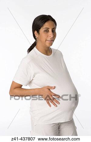 Pregnant woman looking in the camera View Large Photo Image Stock Photo - Pregnant woman looking in the camera. Fotosearch