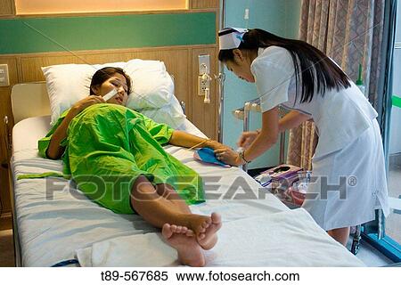 Pregnant woman, nine month in to pregnancy, in the hospital and nurs taking a blod test View Large Photo Image Stock Photography - Pregnant woman, nine month in to pregnancy, in the hospital and nurs taking a blod test. Fotosearch