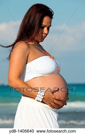 Pregnant woman posing in Miami Beach, Florida, USA View Large Photo Image Stock Image - Pregnant woman posing in Miami Beach, Florida, USA. Fotosearch