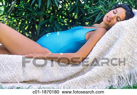 Pregnant woman sleeping in garden View Large Photo Image Stock Image - Pregnant woman sleeping in garden. Fotosearch