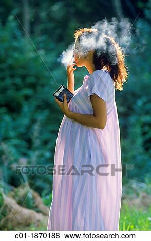 Pregnant woman smoking View Large Photo Image Stock Photo - Pregnant woman smoking. Fotosearch