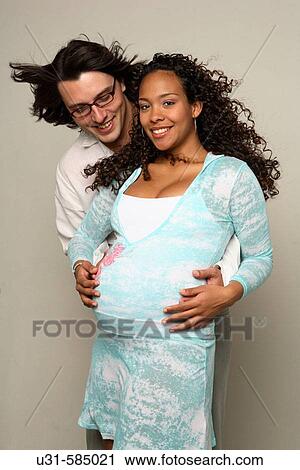 Pregnant woman with her partner. View Large Photo Image Stock Image - Pregnant woman with her partner.. Fotosearch