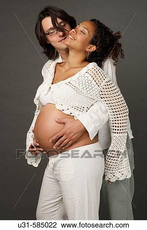 Stock Image - Pregnant woman with her partner.. Fotosearch