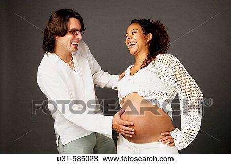 Pregnant woman with her partner. View Large Photo Image Stock Image - Pregnant woman with her partner.. Fotosearch