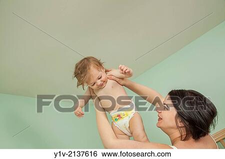 Pregnant woman with her young nephew. View Large Photo Image Stock Photograph - Pregnant woman with her young nephew.. Fotosearch