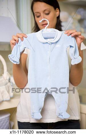 Stock Image - Pregnant women in the baby's room.. Fotosearch