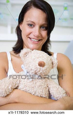 Pregnant women in the baby's room. View Large Photo Image Stock Image - Pregnant women in the baby's room.. Fotosearch