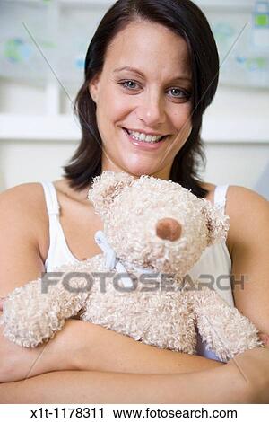 Pregnant women in the baby's room. View Large Photo Image Stock Image - Pregnant women in the baby's room.. Fotosearch