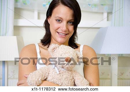 Pregnant women in the baby's room. View Large Photo Image Stock Image - Pregnant women in the baby's room.. Fotosearch