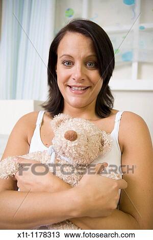 Pregnant women in the baby's room. View Large Photo Image Stock Image - Pregnant women in the baby's room.. Fotosearch