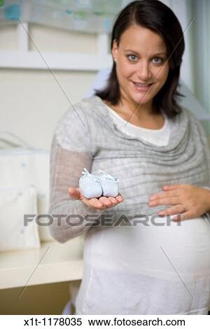 Pregnant women in the baby's room. View Large Photo Image Stock Photography - Pregnant women in the baby's room.. Fotosearch