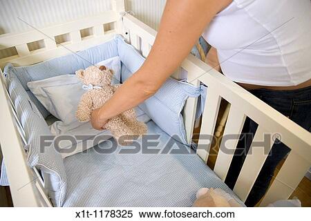 Pregnant women in the baby's room. View Large Photo Image Stock Photography - Pregnant women in the baby's room.. Fotosearch