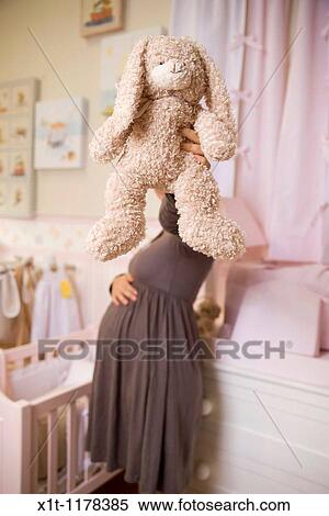 Pregnant women in the baby's room. View Large Photo Image Stock Photography - Pregnant women in the baby's room.. Fotosearch