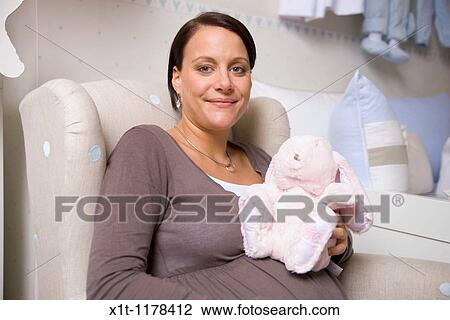 Pregnant women with Stuffed Animals. View Large Photo Image Stock Image - Pregnant women with Stuffed Animals.. Fotosearch