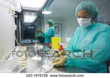 Stock Photograph - Preparation of drugs in laminar flow hood, epidural anesthesia, Clean room, Pharmacy, Hospital Donostia, San Sebastian, Gipuzkoa, Basque Country, Spain. Fotosearch