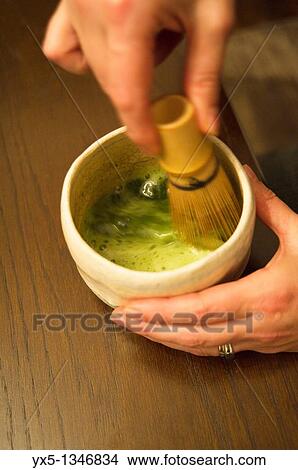 Preparation of Japanese matcha tea in a cup with a whisk View Large Photo Image Picture - Preparation of Japanese matcha tea in a cup with a whisk. Fotosearch