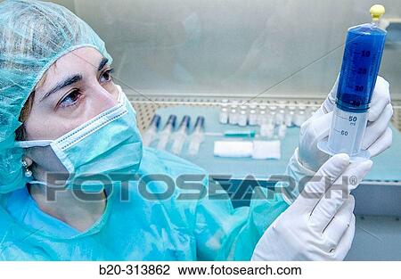 Stock Image - Preparing antibiotic at chemist of hospital. Fotosearch