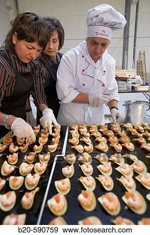 Preparing canapes (snack with prawn, salmon, potato and avocado), Divinus Catering, San Sebastian, Donostia, Gipuzkoa, Basque Country View Large Photo Image Stock Photo - Preparing canapes (snack with prawn, salmon, potato and avocado), Divinus Catering, San Sebastian, Donostia, Gipuzkoa, Basque Country. Fotosearch