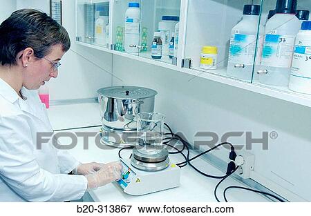 Stock Photo - Preparing medicine at chemist of hospital. Fotosearch