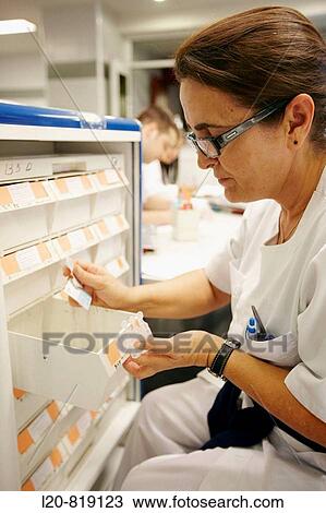 Preparing pharmacy medication carts. Hospital Universitario de Gran Canaria Doctor Negrin, Las Palmas de Gran Canaria. Canary Islands, Spain View Large Photo Image Stock Image - Preparing pharmacy medication carts. Hospital Universitario de Gran Canaria Doctor Negrin, Las Palmas de Gran Canaria. Canary Islands, Spain. Fotosearch