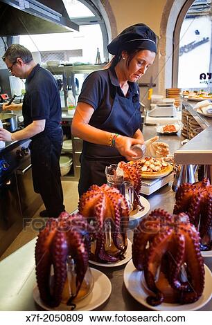 Preparing `Pulpo a feira? octopus in Galician style, Pulper? a Mar? a Pita, En Plaza Mar? a Pita 20, Corua city, Galicia, Spain View Large Photo Image Stock Photo - Preparing `Pulpo a feira? octopus in Galician style, Pulper? a Mar? a Pita, En Plaza Mar? a Pita 20, Corua city, Galicia, Spain. Fotosearch