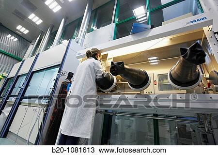 Stock Image - Preparing samples in inert atmosphere, controlled atmosphere glove box, stereo microscope, Synthesis Laboratory, CIC nanoGUNE Nanoscience Cooperative Research Center, Donostia, Gipuzkoa, Euskadi, Spain. Fotosearch