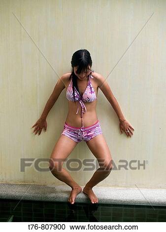 Stock Image - preparing to jump in the pool on Koh Samui Island in Thailand. Fotosearch