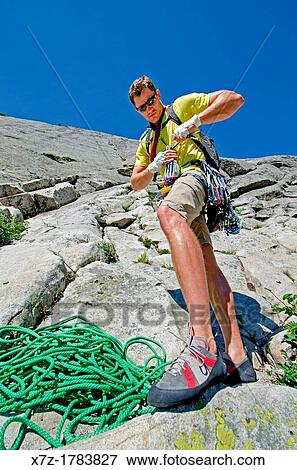 preparing to rock climb a route called the Regular Route which is rated 5, 6 and located on Slick Rock near the city of McCall in the Salmon River Mountains of central Idaho View Large Photo Image Stock Photo - preparing to rock climb a route called the Regular Route which is rated 5, 6 and located on Slick Rock near the city of McCall in the Salmon River Mountains of central Idaho. Fotosearch