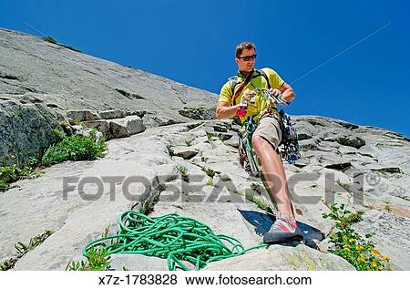 preparing to rock climb a route called the Regular Route which is rated 5, 6 and located on Slick Rock near the city of McCall in the Salmon River Mountains of central Idaho View Large Photo Image Stock Photo - preparing to rock climb a route called the Regular Route which is rated 5, 6 and located on Slick Rock near the city of McCall in the Salmon River Mountains of central Idaho. Fotosearch