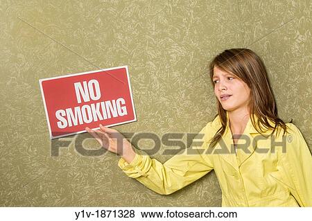Preteen girl holding a? No Smoking? sign View Large Photo Image Stock Photo - Preteen girl holding a? No Smoking? sign. Fotosearch