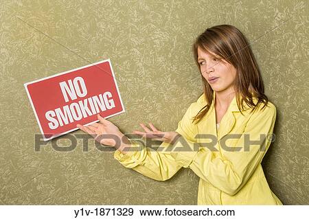 Preteen girl holding a? No Smoking? sign View Large Photo Image Stock Photo - Preteen girl holding a? No Smoking? sign. Fotosearch