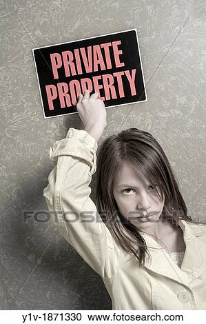 Preteen girl holding a? Private Property? sign View Large Photo Image Stock Image - Preteen girl holding a? Private Property? sign. Fotosearch