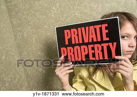 Preteen girl holding a? Private Property? sign View Large Photo Image Stock Image - Preteen girl holding a? Private Property? sign. Fotosearch