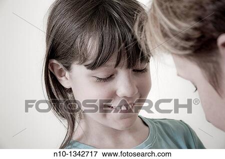 Stock Photo - Preteen girl with her mother. Fotosearch