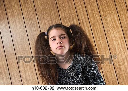 Preteen girl, with two large ponytails, posing View Large Photo Image Stock Image - Preteen girl, with two large ponytails, posing. Fotosearch
