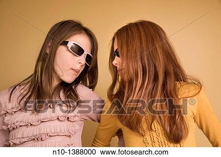 Preteen girls wearing sunglasses View Large Photo Image Stock Image - Preteen girls wearing sunglasses. Fotosearch