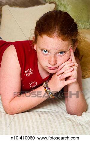 Preteen redhead girl, in Connecticut, USA, reclining on her mother's bed, thinking. View Large Photo Image Stock Image - Preteen redhead girl, in Connecticut, USA, reclining on her mother's bed, thinking.. Fotosearch