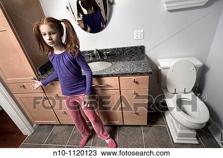 Preteen redhead girl in her bathroom View Large Photo Image Stock Image - Preteen redhead girl in her bathroom. Fotosearch