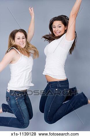 Pretty 20-something women jumping View Large Photo Image Stock Photo - Pretty 20-something women jumping. Fotosearch