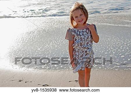 Pretty baby girl at the beach View Large Photo Image Stock Photo - Pretty baby girl at the beach. Fotosearch