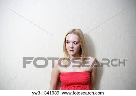 pretty blond girl in red wear indoors View Large Photo Image Stock Photo - pretty blond girl in red wear indoors. Fotosearch