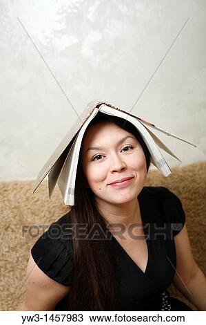 pretty brunette girl indoors on modern sofa View Large Photo Image Stock Image - pretty brunette girl indoors on modern sofa. Fotosearch