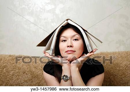 pretty brunette girl indoors on modern sofa View Large Photo Image Stock Photograph - pretty brunette girl indoors on modern sofa. Fotosearch