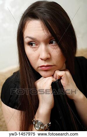 pretty brunette girl indoors on modern sofa View Large Photo Image Stock Photography - pretty brunette girl indoors on modern sofa. Fotosearch