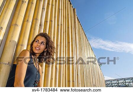 Pretty Brunette posed in bamboo background at Ebro riverside at ExpoZaragoza outdoors area, Saragossa, Aragon, Spain View Large Photo Image Picture - Pretty Brunette posed in bamboo background at Ebro riverside at ExpoZaragoza outdoors area, Saragossa, Aragon, Spain. Fotosearch