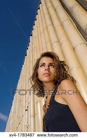 Pretty Brunette posed in bamboo background at Ebro riverside at ExpoZaragoza outdoors area, Saragossa, Aragon, Spain View Large Photo Image Stock Photo - Pretty Brunette posed in bamboo background at Ebro riverside at ExpoZaragoza outdoors area, Saragossa, Aragon, Spain. Fotosearch