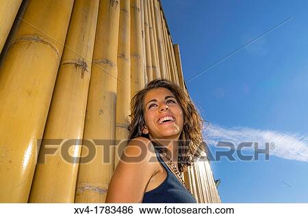 Pretty Brunette posed in bamboo background at Ebro riverside at ExpoZaragoza outdoors area, Saragossa, Aragon, Spain View Large Photo Image Stock Photograph - Pretty Brunette posed in bamboo background at Ebro riverside at ExpoZaragoza outdoors area, Saragossa, Aragon, Spain. Fotosearch
