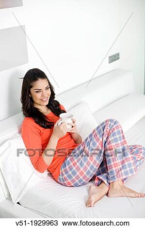 Pretty brunette woman enjoying breakfast in bed View Large Photo Image Stock Image - Pretty brunette woman enjoying breakfast in bed. Fotosearch