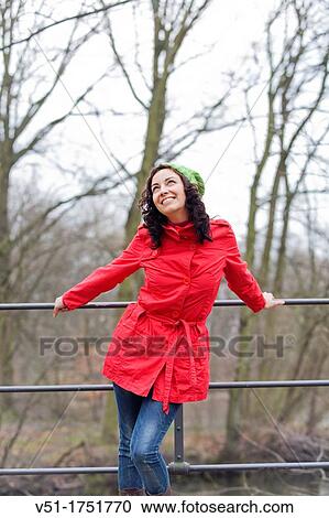 Pretty brunette woman in winter in a park View Large Photo Image Stock Image - Pretty brunette woman in winter in a park. Fotosearch