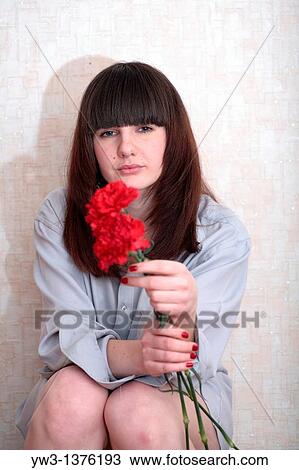 Pretty brunette woman indoors with flowers View Large Photo Image Stock Image - Pretty brunette woman indoors with flowers. Fotosearch